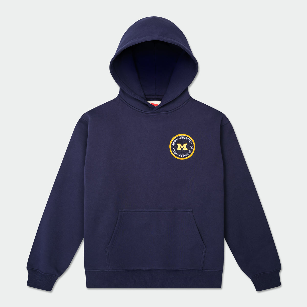 Navy blue hoodie with a logo on the chest against a light gray background